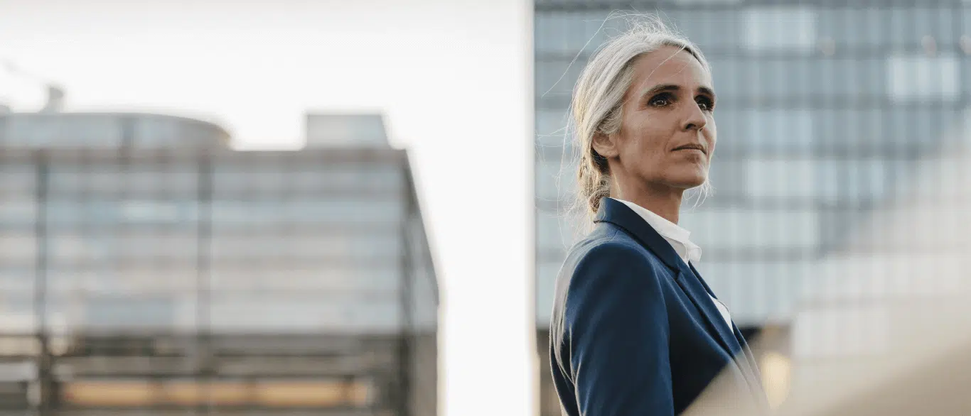 business woman looking over city