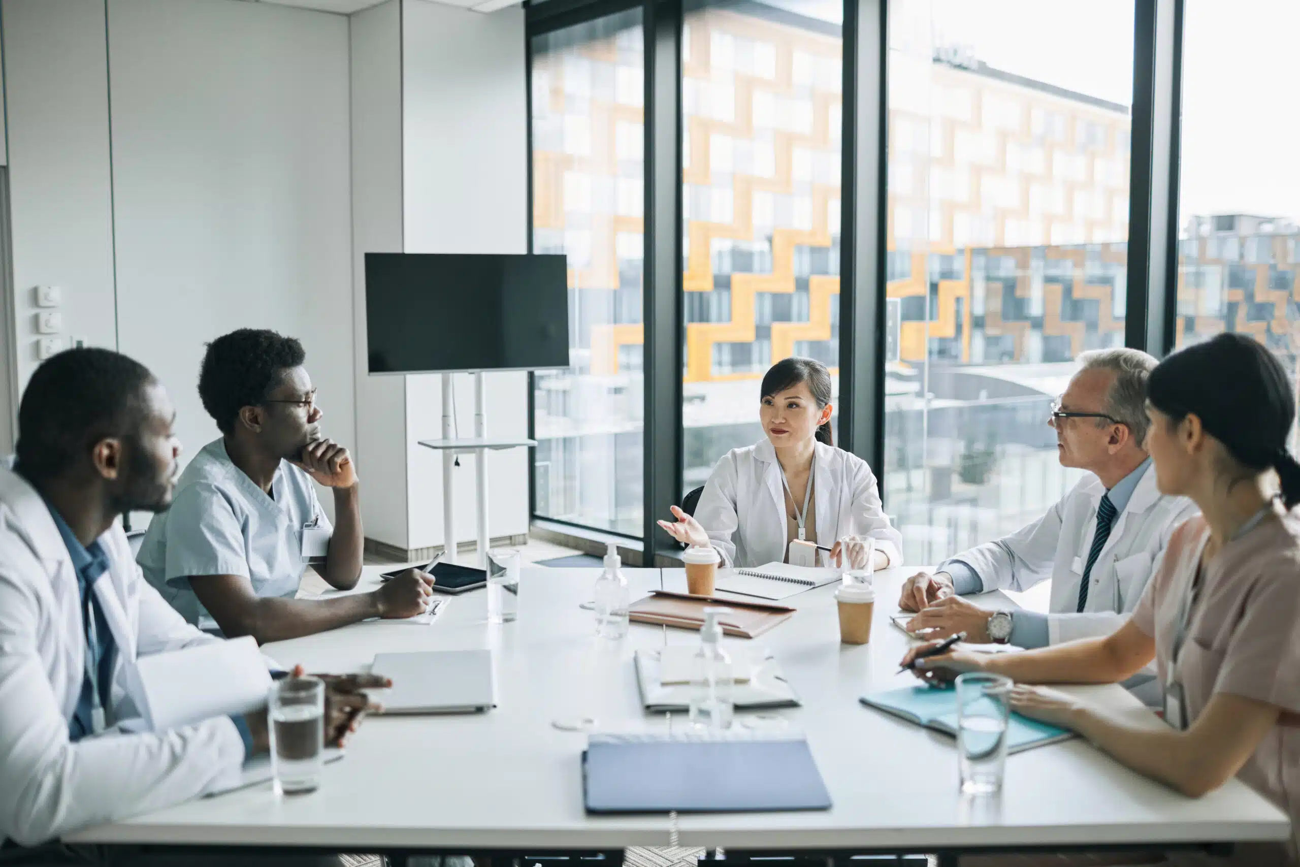 Physicians having conversation at table