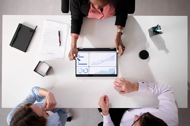 Financial services professionals discussing marketing strategy