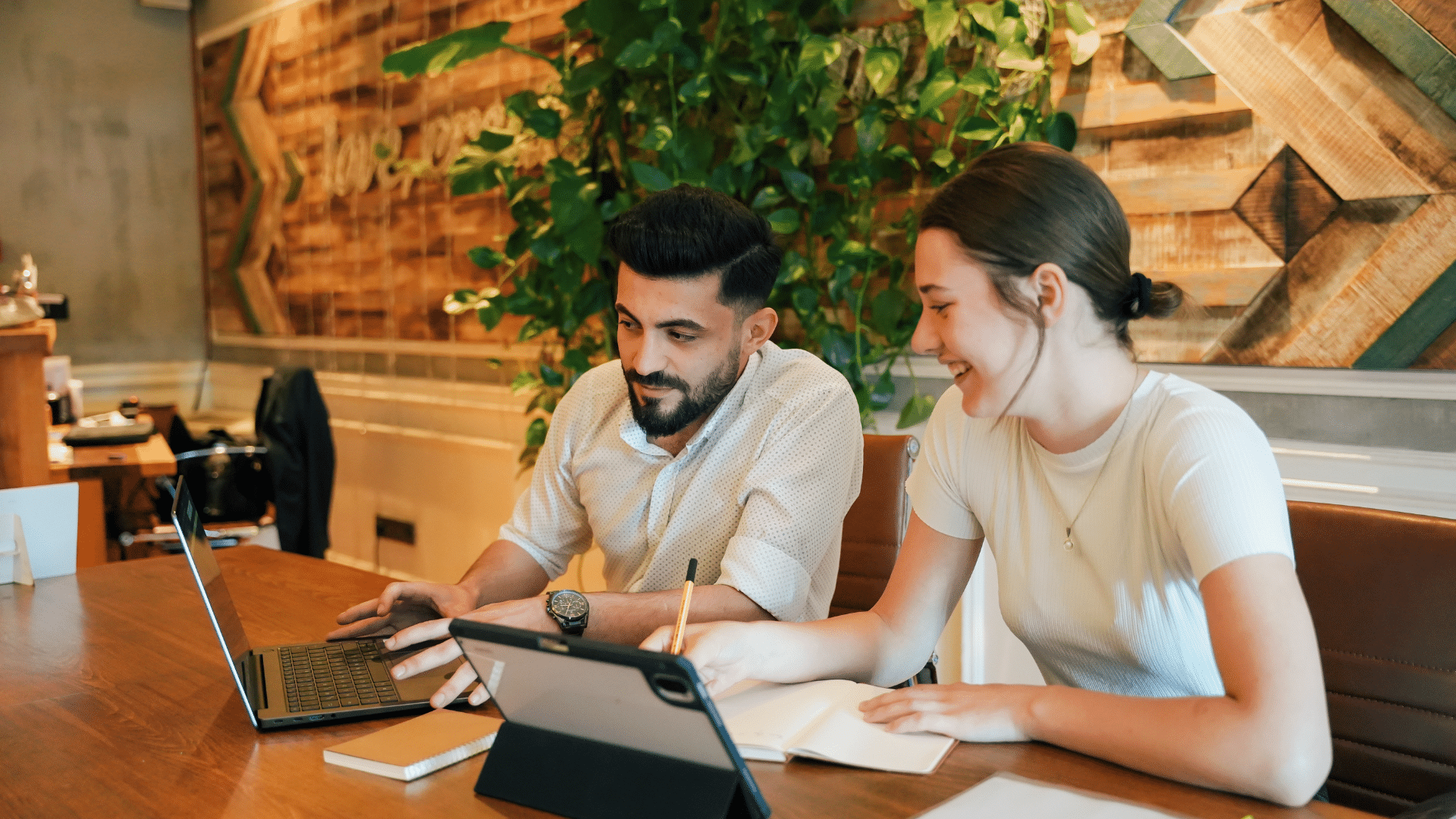 Nonprofit employees sit together at an office table discussing how to adapt to new philanthropy tax laws in 2026