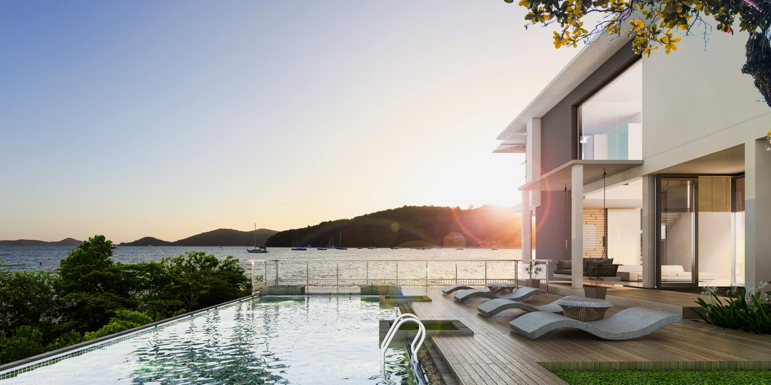 Scenic view of a luxury waterfront home’s backyard overlooking the water at sunset, representing affluent lifestyles and ultra-high-net-worth audiences.