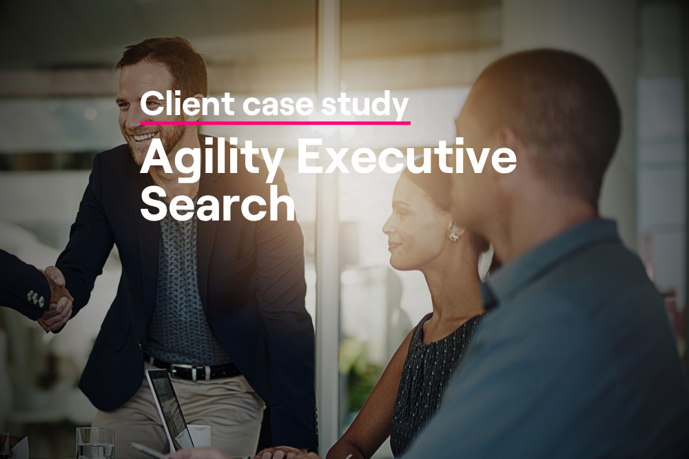 Business professionals shaking hands in a sunlit office, illustrating successful board candidate connections in Agility Executive Search's BoardEx case study